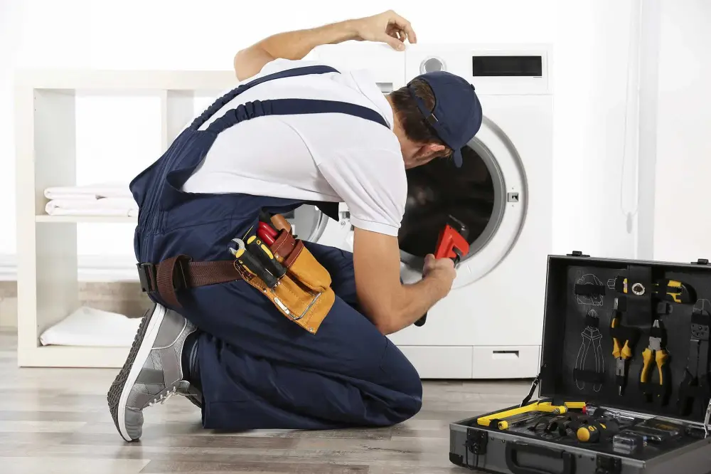 A hard working is fixing Dryer issues in the villages